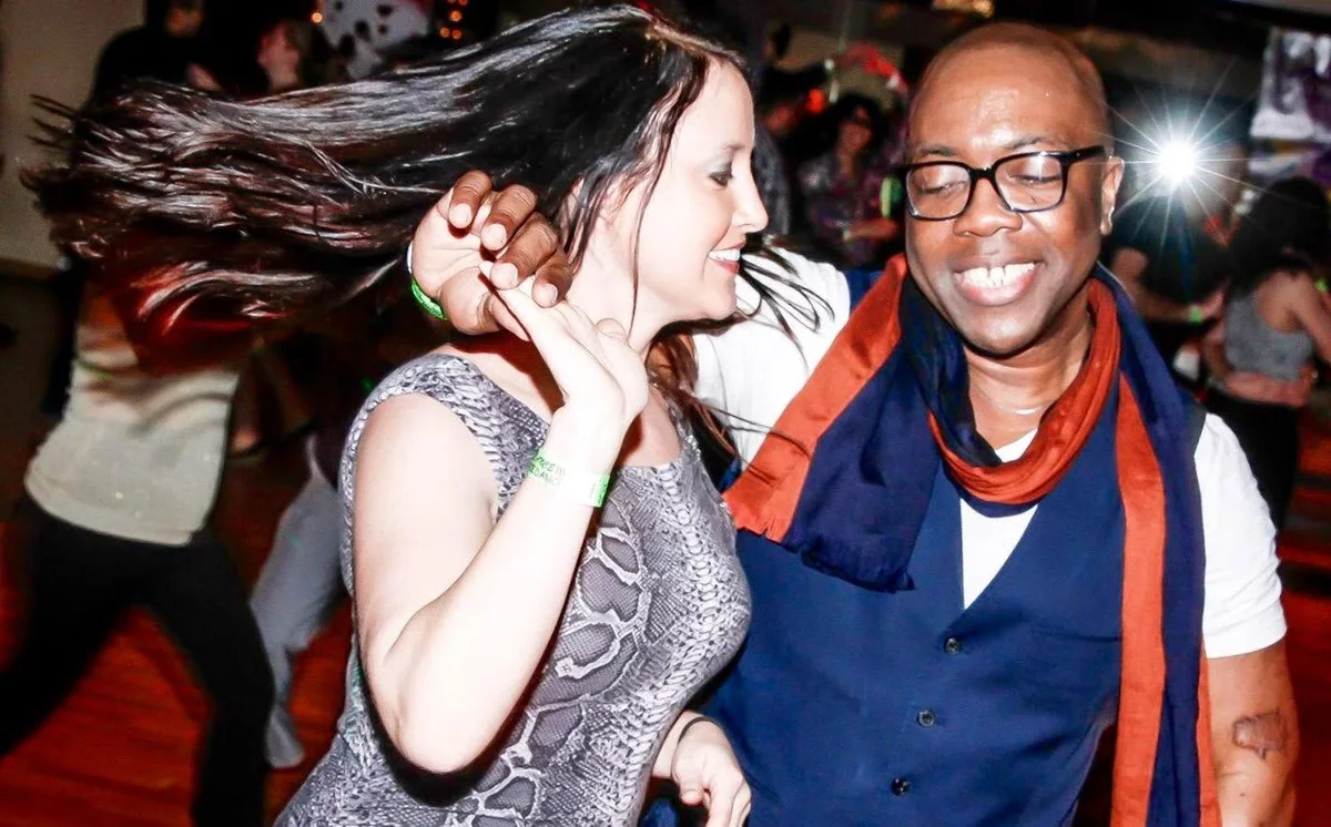 Shacoda and a dance partner enjoying a turn on the dance floor