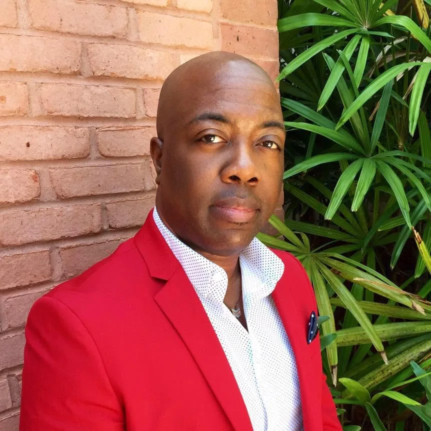 Shacoda, Salsa Soul’s dance instructor and DJ, in a red jacket